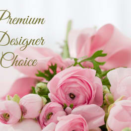 Pink ranunculus bouquet with green accents and the words Premium Designer Choice