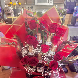 Bouquet of red roses with beer bottles and red wrapping