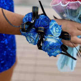 Blue rose wrist corsage with black ribbon ties