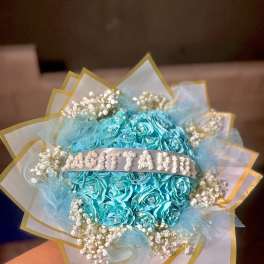 Turquoise rose bouquet with baby's breath and gold-edged wrapping