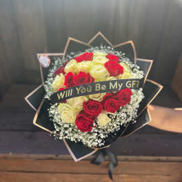 Bouquet of red and cream roses with a "Will You Be My GF?" ribbon