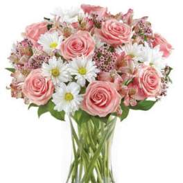 Pink roses and white daisies in a clear glass vase