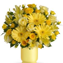 Yellow roses and daisies in a yellow vase