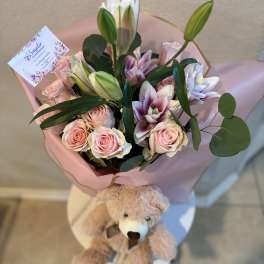 Pink rose and lily bouquet with a teddy bear attached