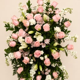 Large pink and white floral standing spray with roses and lilies