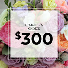 Graphic over a pastel bouquet of mixed roses with text reading Designer’s Choice $300.
