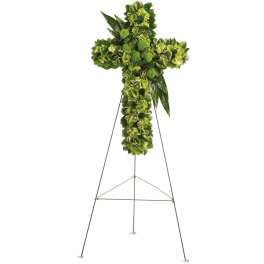 Green floral cross on a metal easel