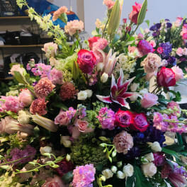Large mixed bouquet with pink roses, lilies, and carnations