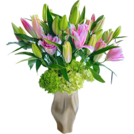 Pink lilies and green hydrangeas in a metallic vase