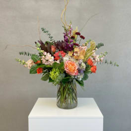 Mixed floral arrangement in a clear glass vase