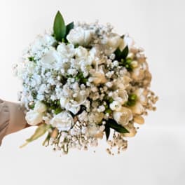 White bouquet with baby's breath and green accents