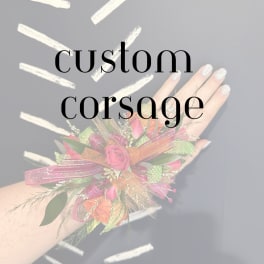 Custom corsage with pink roses and ribbon on a wrist