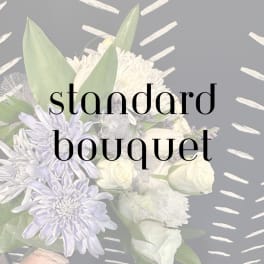 White and pale lavender bouquet with large blooms and broad leaves