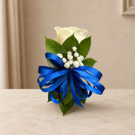 White calla lily arrangement with a blue ribbon bow