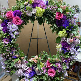 Large floral wreath with pink, purple, and lavender flowers