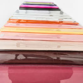 Stack of colorful wrapped floral sleeves or paper sheets