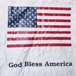 Quilt with an American flag and the words God Bless America