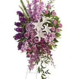 Tall purple and white floral spray on a stand
