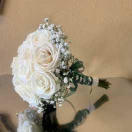 White rose bouquet with baby's breath and green ribbon wrap