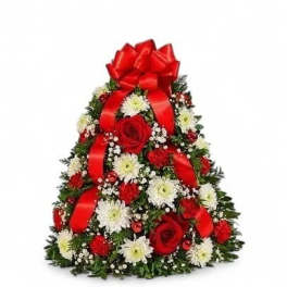 Christmas tree-shaped floral arrangement with red roses and white daisies, topped by a red bow