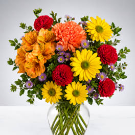 Colorful mixed bouquet in a clear glass vase