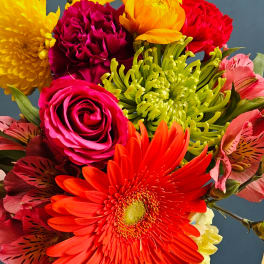 Bright mixed bouquet with gerbera daisies, roses, carnations, and alstroemeria