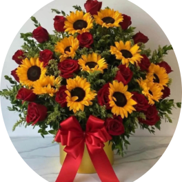 Sunflowers and red roses in a yellow box with a red ribbon