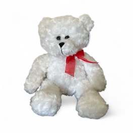White plush teddy bear with a red ribbon bow around its neck