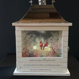 Decorative lantern with a cardinal scene and memorial quote