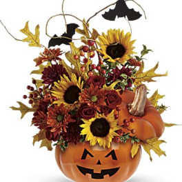 Halloween pumpkin container with sunflowers, mums, and bats