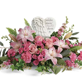Pink lilies and roses arranged with a memorial angel heart plaque