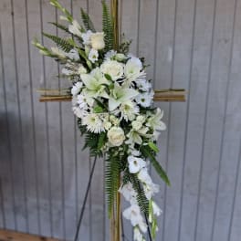 White floral standing spray on a bamboo easel