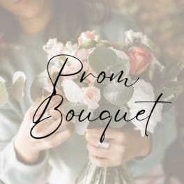 Person holding a pastel bouquet with roses and white blooms