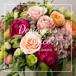 Mixed bouquet of roses, peonies, and hydrangeas in pink, peach, and green tones
