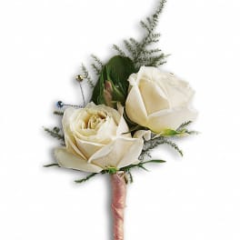 Small boutonniere with two ivory roses and a blush ribbon-wrapped stem