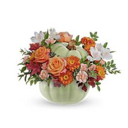 Pumpkin-shaped vase with orange roses and mixed fall flowers