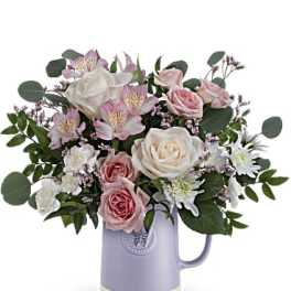 Pink and white roses with alstroemeria in a lavender mug
