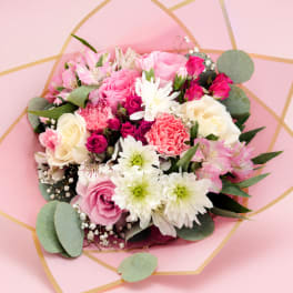 Pink and white mixed bouquet with roses, carnations, and daisies