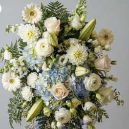 Soft touch of blue Funeral Spray