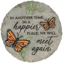 Decorative stone plaque with butterflies and the phrase "In another time, in a happier place, we will meet again."