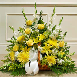 Yellow and white basket arrangement with roses, lilies, and mums