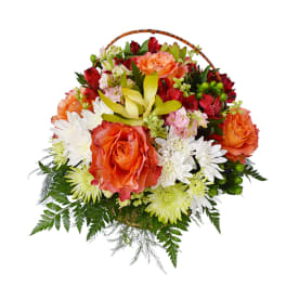 Basket arrangement of orange roses, white daisies, and mixed blooms