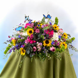 Large mixed bouquet with sunflowers, roses, and butterflies