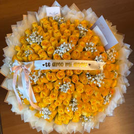 Large bouquet of yellow roses with white baby's breath and a ribbon