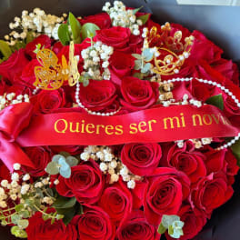 Red rose bouquet with a red ribbon and gold butterfly accents