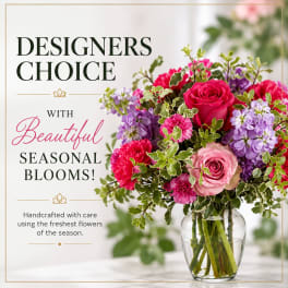 Mixed pink and purple bouquet in a clear glass vase