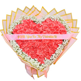 Heart-shaped bouquet of pink carnations with a Valentine ribbon