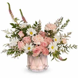 Pink roses and white daisies in a clear glass vase