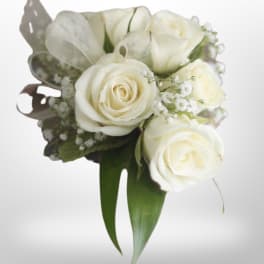 White rose bouquet with baby's breath and green leaves