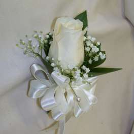White rose boutonniere with baby's breath and satin ribbon